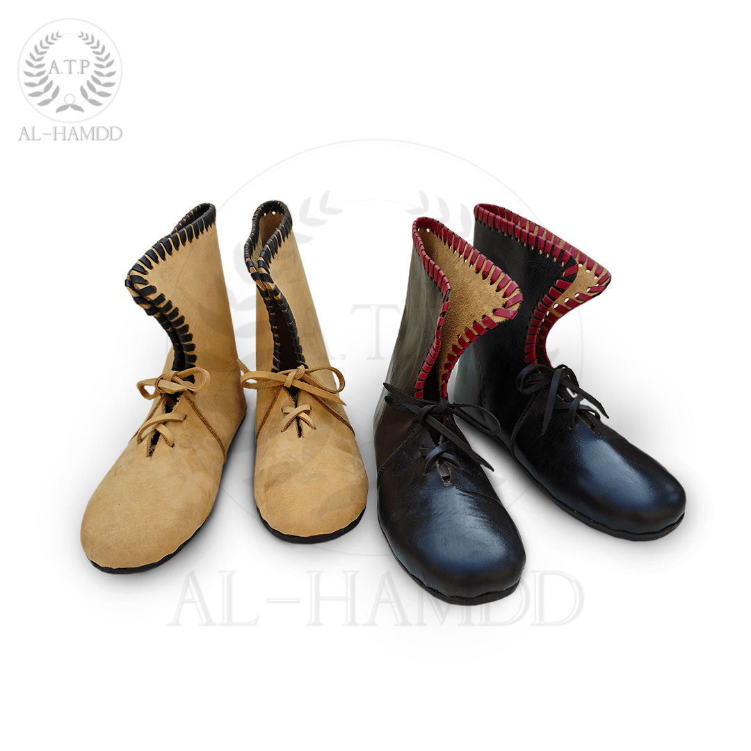 Roman calcei boots in two variants i.e. un coloured and black and red edging around the high ankle back suitable for reenactment